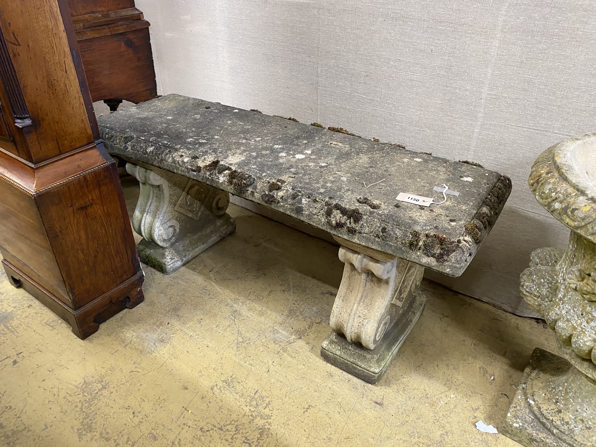 A reconstituted stone rectangular garden bench, length 116cm, depth 40cm, height 50cm